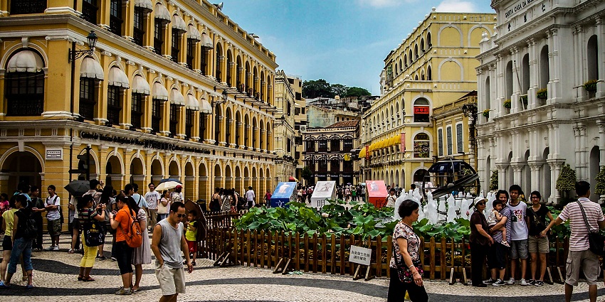A peaceful town square with open paths, charming buildings, and relaxed village views.