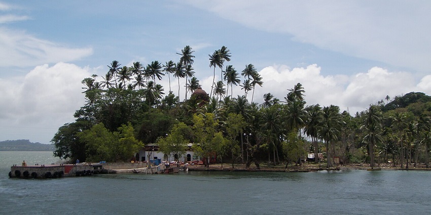 Panoramic view of Viper Island with lush greenery and remnants of colonial-era structures