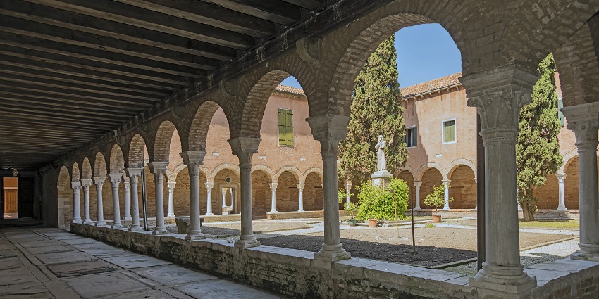Admire the peaceful 14th-century Cloister of San Francesco with its elegant columns and garden.