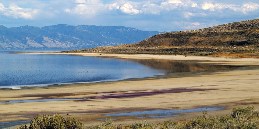 Things to do in Salt Lake City in February include walking along the shoreline of the vast Great Salt Lake under a dramatic winter sky.