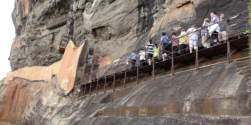 Polished ancient wall with historic graffiti and inscriptions reflecting Sigiriya’s cultural legacy and royal artistry, one of the best things to do in Sigiriya.