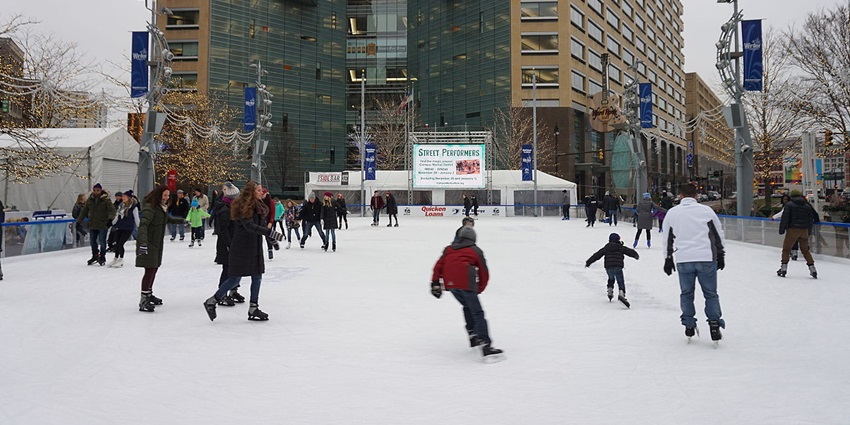 Glide across the ice rink at Campus Martius, surrounded by festive lights and the bustling heart.