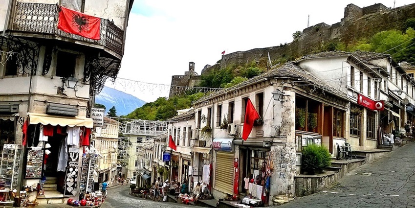 Things to do in Albania include strolling the historic cobblestone streets of Gjirokastër, lined with Ottoman-era architecture.