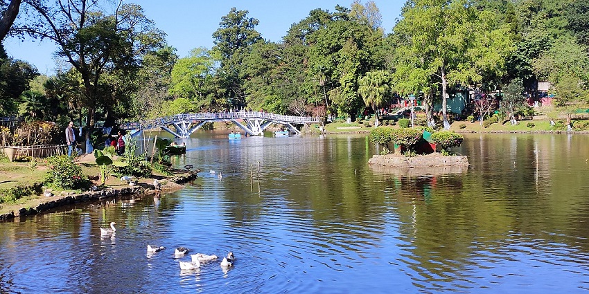 Ward’s Lake in Shillong with a large water body and a distant architectural bridge over.