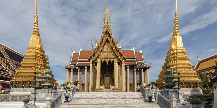 The Temple of the Emerald Buddha in Bangkok, Thailand, featuring gold details and traditional Thai architecture.