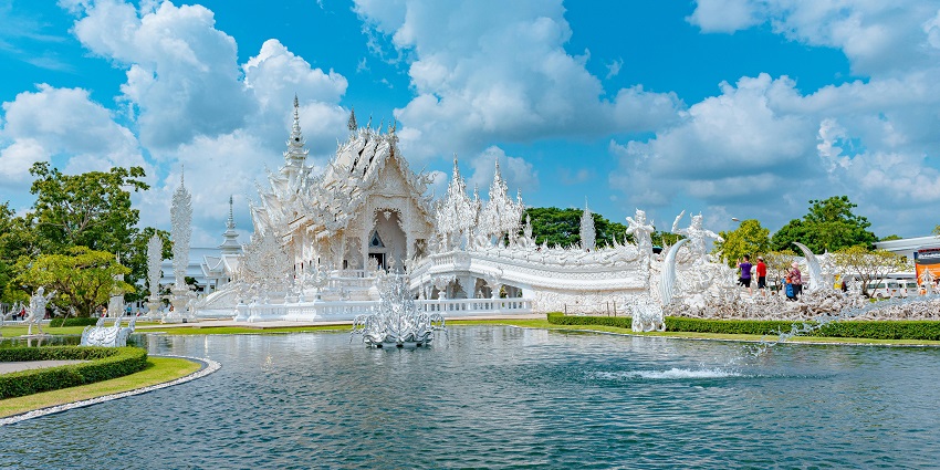 A stunning white temple with fascinating details and statues, Wat Rong Khun in Chiang Rai, Thailand, is among the famous monuments in Thailand.