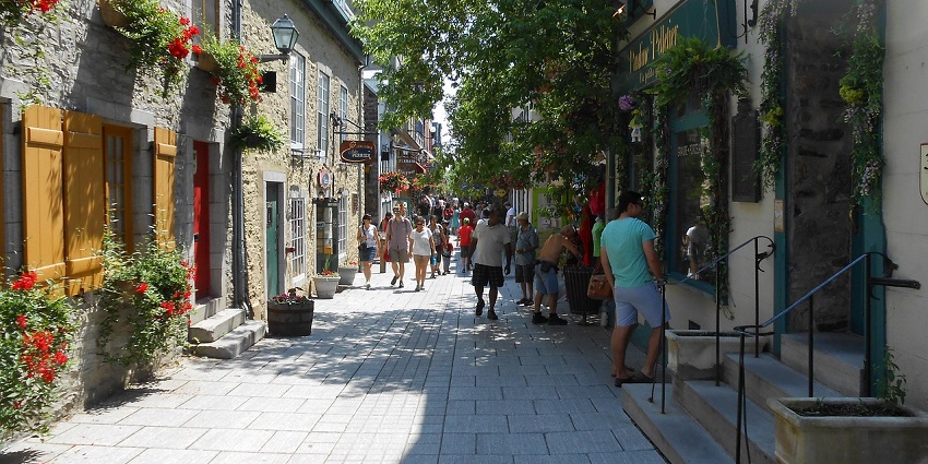 Everyday life in Quebec City with calm streets and friendly faces, showing what is the safest city in Canada.