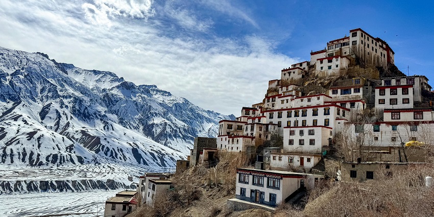 Traditional whitewashed houses in a Spiti Valley village surrounded by mountains, amongst the top things to do in Lahaul and Spiti.