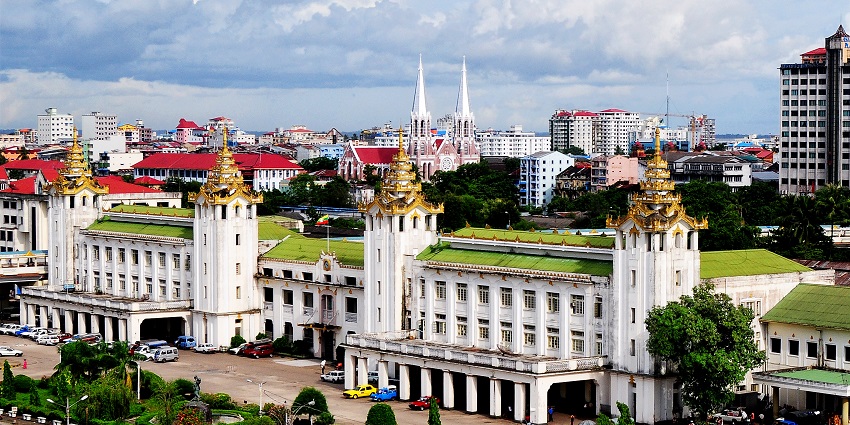 Yangon Central Railway Station exterior with traditional Burmese tiered roof design