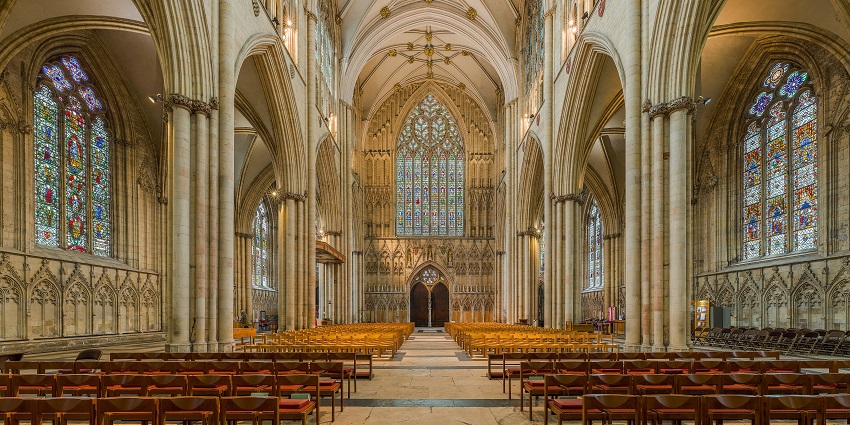 Interior of york minster with detailed architecture and unique designs on the windows