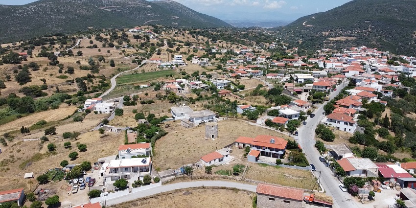 Zarakes village from above with roofs of multiple buildings and streets of the village.
