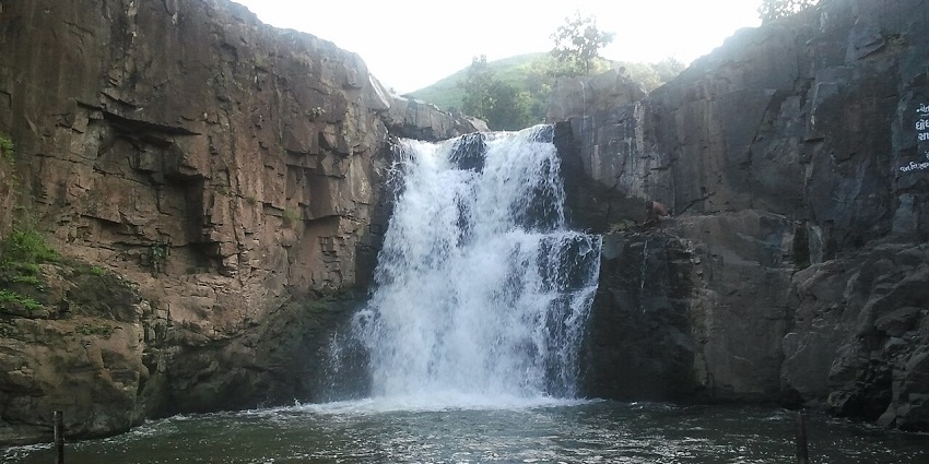 Stunning cascades of  Zarwani Waterfalls, one of the famous places to visit in Gujarat in November.