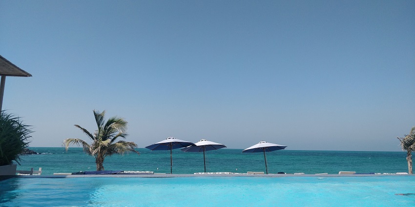 A serene infinity pool overlooks the turquoise sea at Zaya Nurai Island, a luxurious private getaway among the islands in the UAE.