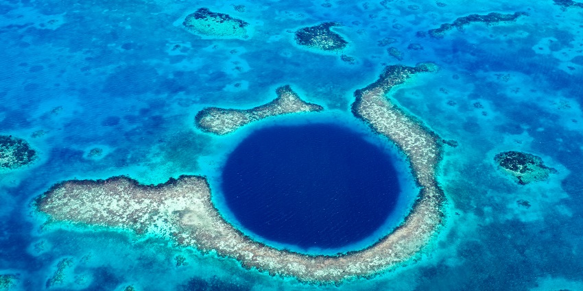 Dive into blue holes and explore marine life near the tropical Nomuka Island.