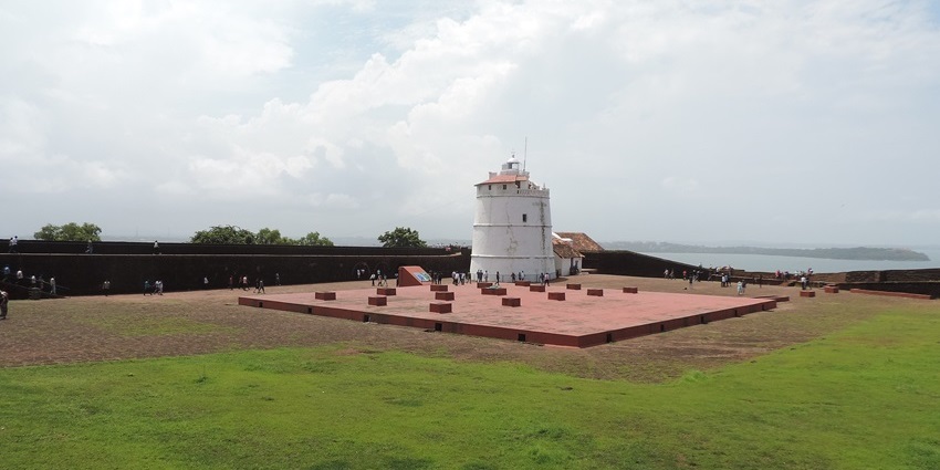 Aguada Fort in North Goa featuring a historic white tower and coastal views.