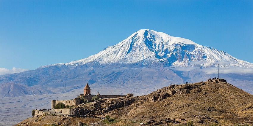 Khor Virap Monastery in Armenia with Mount Ararat in the background on a clear day.
