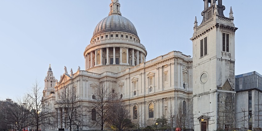 St. Paul’s Cathedral with its iconic dome and grand façade under a partly cloudy London sky.