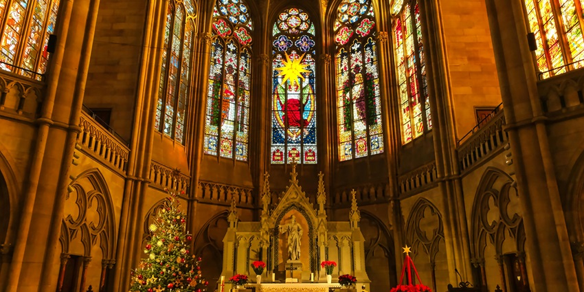 Interior of Co-Cathedral of the Sacred Heart beautifully decorated with Christmas lights and ornaments.