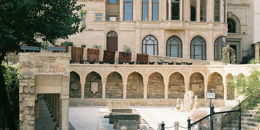 An open-air museum in Old Town Baku displaying ancient relics and historical artifacts.
