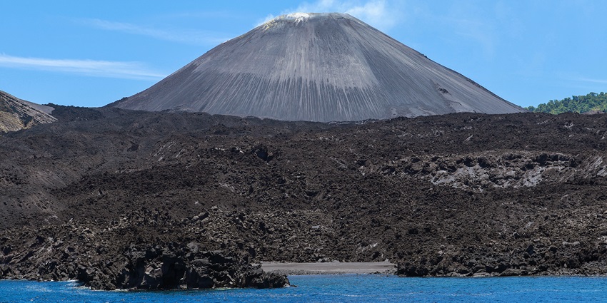 Barren Island in the Andaman Sea with its active volcanic crater rising above the sea.
