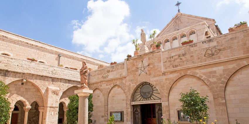 Outside the Church of the Nativity, with its old structure, one of the best places to visit near Jerusalem.