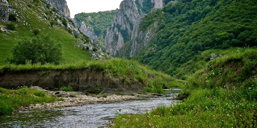 Bijambare Nature Park with lush greenery, flowing rivers, and scenic hills in the landscape amongst the best places to visit near Sarajevo.