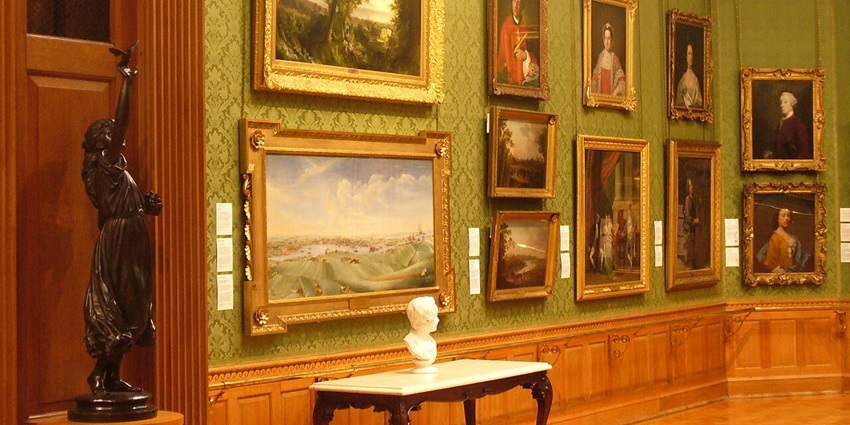 The interior wall of the Aberdeen Art Gallery features framed artworks and sculptures, one of the best things to see in Makawao.