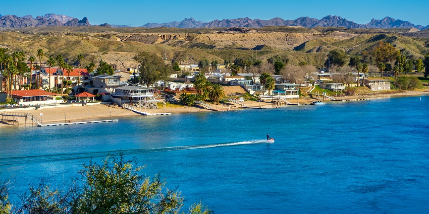 Riverfront houses on the Colorado River in Bullhead City, peaceful places to visit near California.