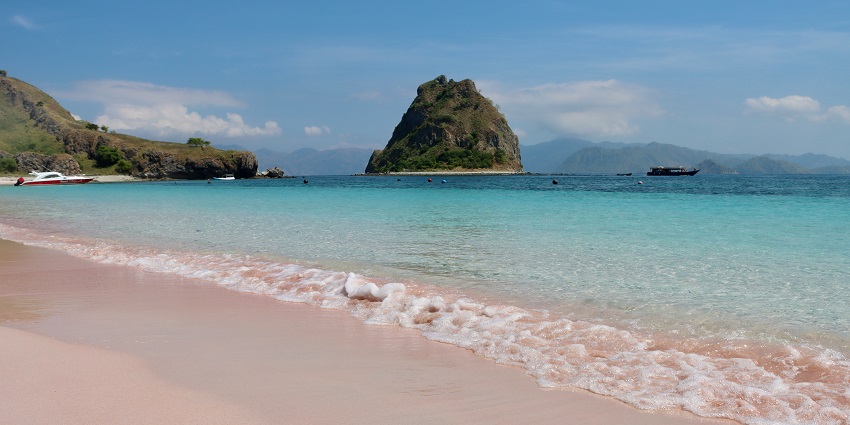 Golden sands and calm waves at Carita Beach, one of the relaxing places to visit near Jakarta.

