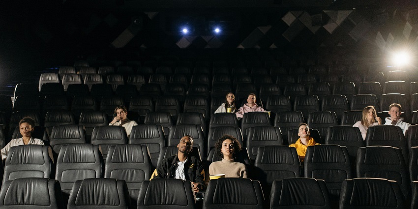 Interior view of Beachwalk Cinema with people watching the movie.