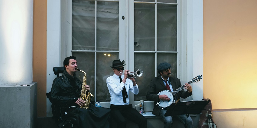 A lively band performing with instruments at The Underground.