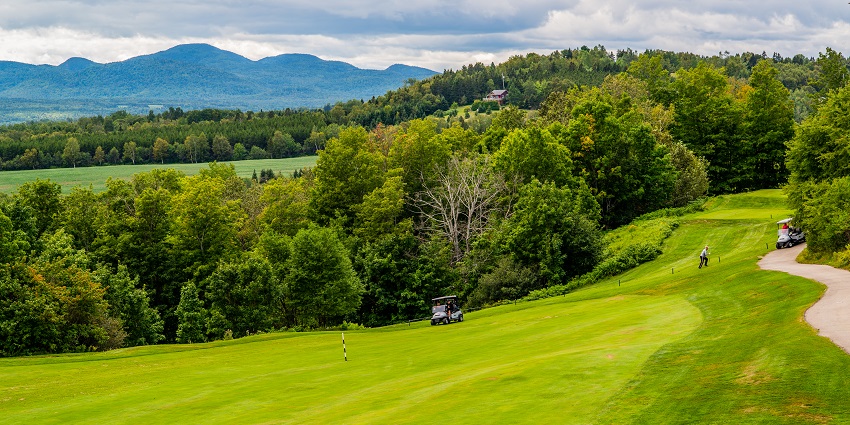 The Charlevoix Astroblème, surrounded by grass and trees, places to visit near Quebec City.