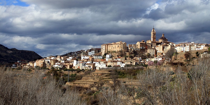 Chelva Vista with traditional architectural Spanish buildings, structures, and mountains.