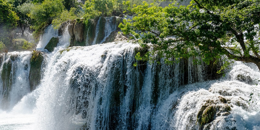 Scenic Chreav Waterfall cascading over rocks, a hidden gem among places to visit near Phnom Penh.