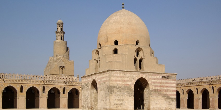 Historic courtyard of the Mosque of Ibn Tulun, featuring central ablution fountain.