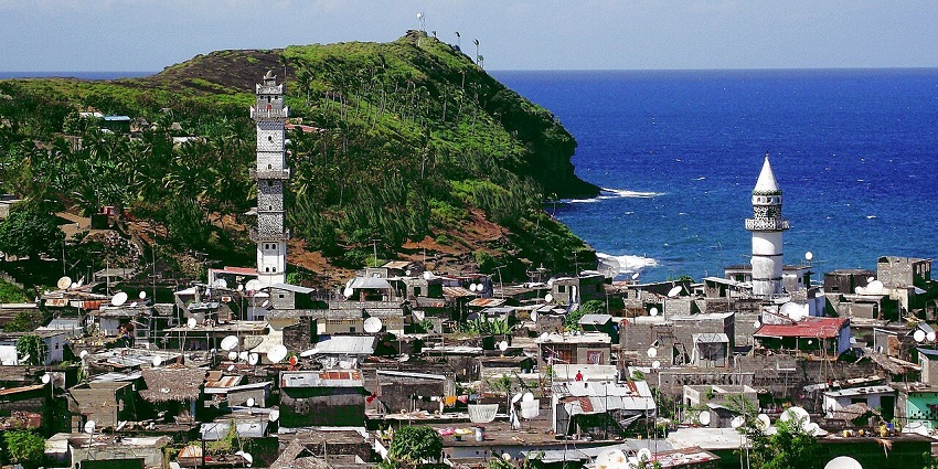 Lush green hills and coastal views on Anjouan Island, Comoros.
