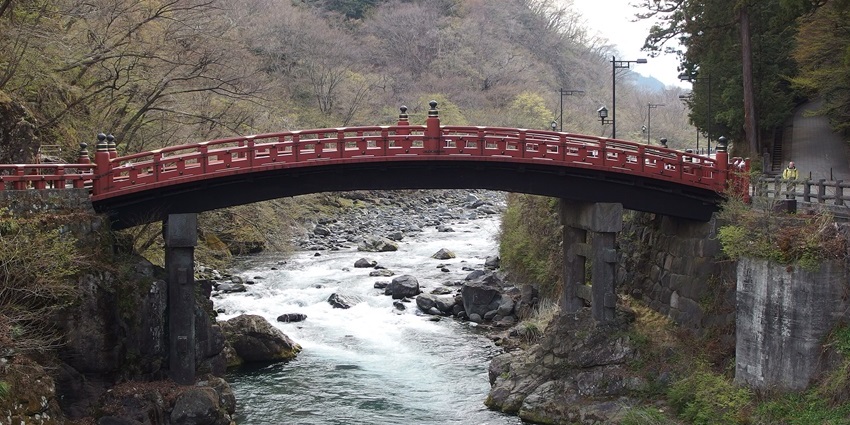 Cross the iconic red Shinkyo Bridge, a stunning highlight among things to do in Nikko.