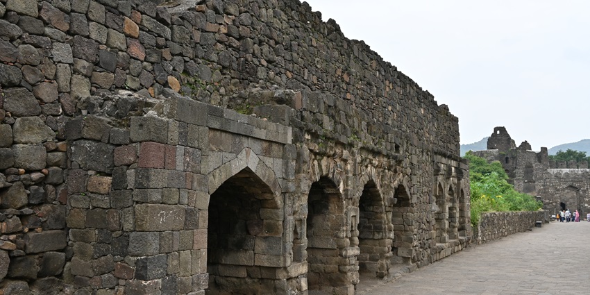 View of Daulatabad Fort showing ancient stone structure, thick walls, and rugged textures.