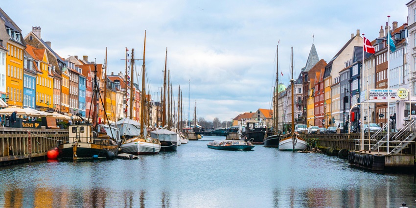 Colorful buildings and waterfront view of Copenhagen, Denmark’s vibrant capital city.