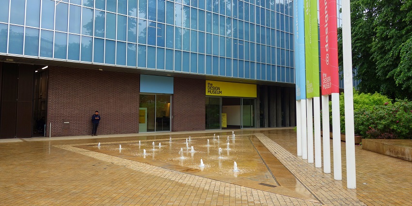Exterior of the Design Museum in Kensington with a modern facade and a waterfall in front.