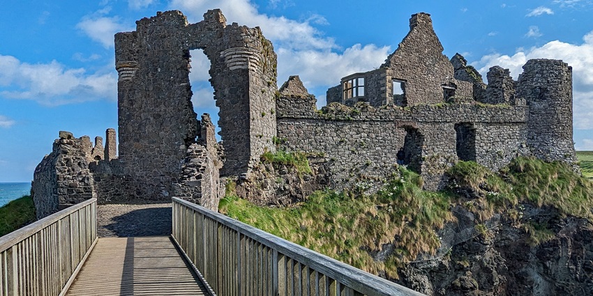 Ancient cliffside ruins overlook the crashing waves, blending history with ocean views.