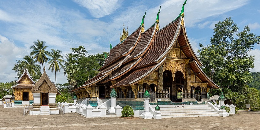 Wat Xieng Thong temple with a gilded roof and intricate carvings in Luang Prabang, Laos.