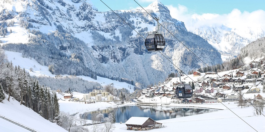 Snow-covered Engelberg mountains with a cable car, the top places to visit near Lucerne.