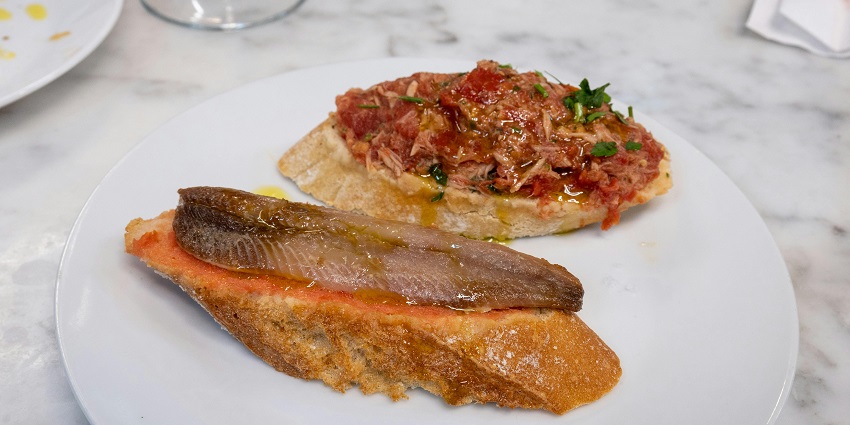Savoring fresh seafood at Mercado Del Peix is one of the tastiest things to do in Menorca Spain.