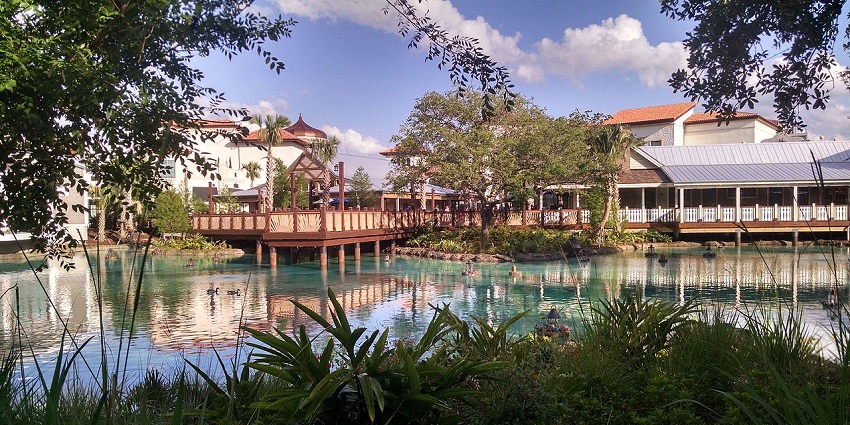 Disney Springs shopping and dining district with waterfront views and colorful storefronts.