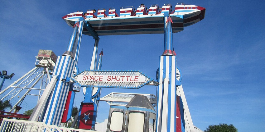 Enjoying thrilling rides at Sky Ranch Pampanga with the iconic space shuttle in view.