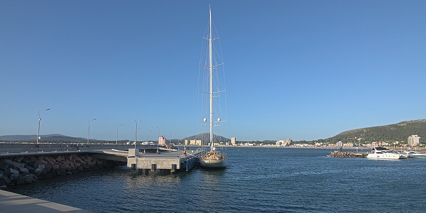 Piriapolis port with white boats docked nearby, visitors enjoying the view, things to do in Piriapolis Uruguay.
