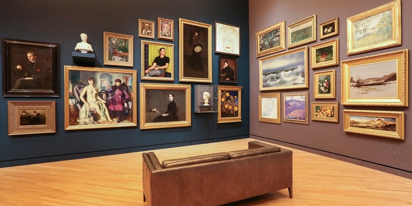 Interior view of the Lowe Mill Arts & Entertainment with artwork on display.