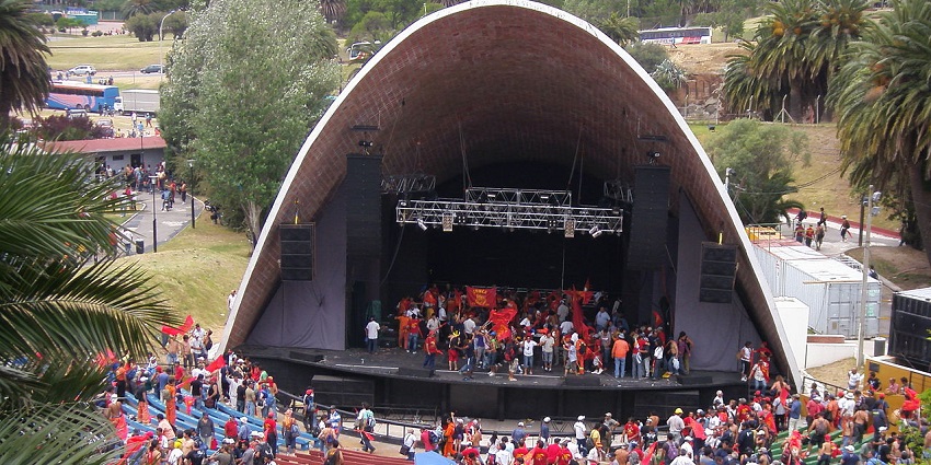 Teatro de Verano outdoor amphitheater with stage, seating area, and surrounding trees in Uruguay.