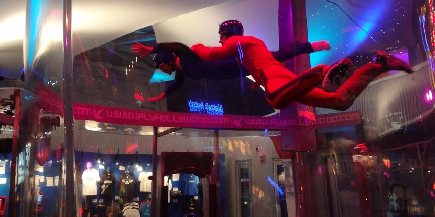 A person skydiving indoors at iFLY Seattle, floating in a wind tunnel, one of the best things to see in Lynnwood.